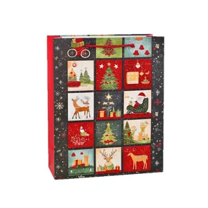 Festive Christmas paper gift bag with grid patterns and glitter finish on white background