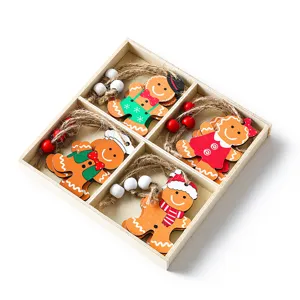 Festive set of 4 wooden gingerbread man Christmas ornaments in a rustic wooden storage box