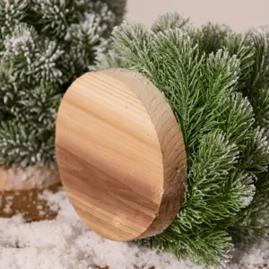 Tabletop snowy Christmas tree with natural wood base and realistic PE needles