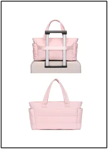 Pink quilted travel bag showing the luggage strap fixed on a suitcase handle