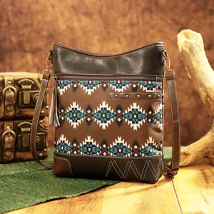Vintage bohemian Aztec print crossbody bag with tassel and faux leather details.