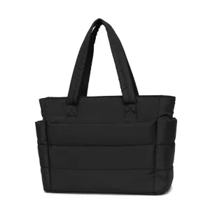 Front view showing quilted puffer texture of black large capacity lightweight travel bag