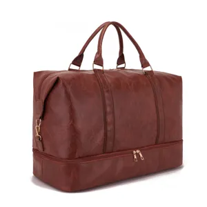 Bolsa de viaje grande de cuero marrón con un compartimento inferior para zapatos
