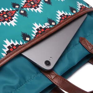 Detail of Bohemian Aztec laptop tote showing tablet fitting inside waterproof interior.