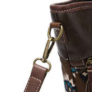 Close-up of vintage bronze hardware and strap on Bohemian Aztec printed crossbody bag