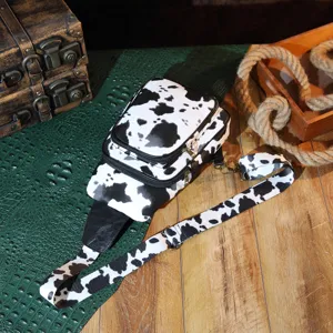 Vintage cow print crossbody chest bag with adjustable strap and multi-pocket design.