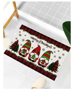 Detailed view of festive Christmas gnomes doormat with red plaid border on a white tile floor