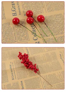 Macro detail of artificial red berry clusters and single stems for festive home decor
