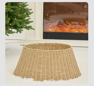 Elegant natural woven wicker Christmas tree collar displayed on a white plush rug