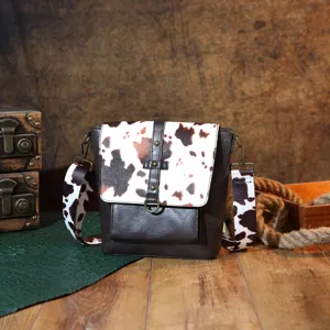 Detailed view of a Western bohemian crossbody bag with stylish cow print pattern