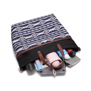Detail of Bohemian Aztec tote bag showing large capacity with tablet and accessories.