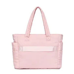 Large capacity pink quilted travel bag with shoulder straps and side pockets