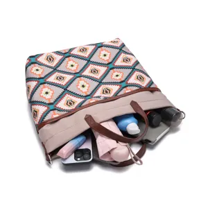 Detail of Aztec print waterproof tote bag showing capacity for daily essentials