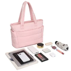 Pink quilted tote bag with organized daily essentials showing spacious capacity