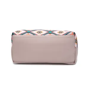 Detailed view of Aztec patterned laptop bag with waterproof twill and solid beige base