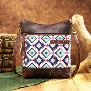 Vintage Aztec print crossbody bag with bohemian tassel and brown leather trim