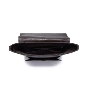 Detailed top-down view of dark brown vintage crossbody bag showing internal compartments