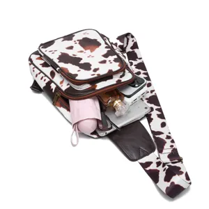 Western style cow print sling chest bag with spacious interior for daily essentials