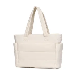 Front view of a cream-colored quilted tote bag with large capacity for travel and gym.