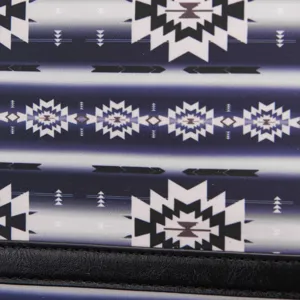 Detailed view of the ethnic Aztec pattern fabric and black faux leather trim on a backpack