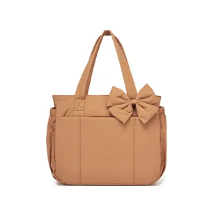 Ampia borsa tote marrone in cotone con grande fiocco decorativo per viaggi all'aperto casual