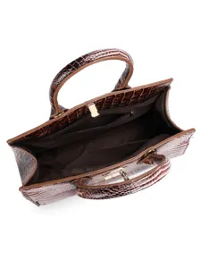Vista interna della borsa marrone coccodrillo con ampio scomparto e tasche interne