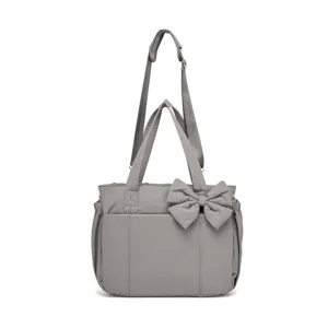 Borsa a tracolla grigia in cotone con fiocco decorativo e tracolla regolabile.