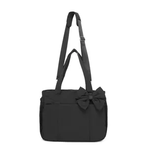 Elegante borsa a tracolla nera in cotone trapuntato con fiocco decorativo grande