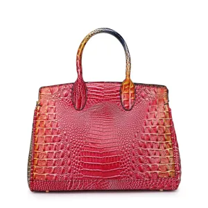 Vista ravvicinata della borsa tote di lusso con goffratura a coccodrillo rossa e arancio.