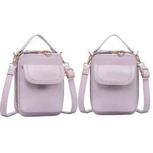 Vista frontal de dos bolsos mensajeros modernos de color lavanda uno al lado del otro