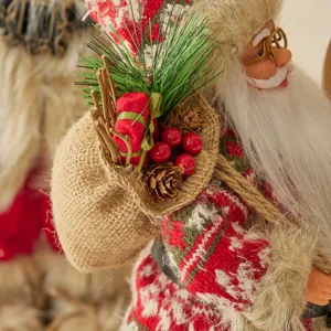 Statuetta di Babbo Natale in piedi con sacco di juta decorazione natalizia.