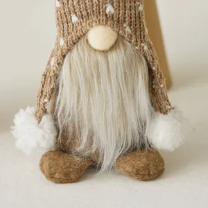 Handcrafted Nordic Christmas gnome doll featuring brown knitted hat and long white beard