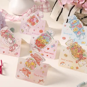 Close-up detail of cute cartoon candy bouquet greeting cards with English blessings