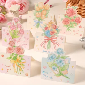 Vista dettagliata di vari biglietti d'auguri 3D con illustrazioni di bouquet colorati