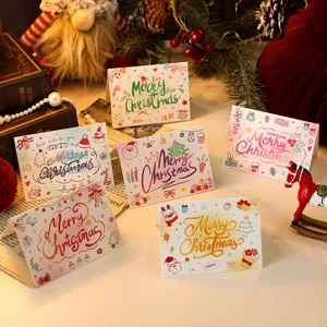 Detailed view of colorful cartoon Christmas greeting cards with festive illustrations