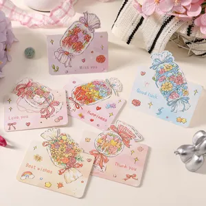 Close-up of creative cartoon candy flower greeting cards with various English wishes.