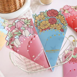 Detail view of colorful bouquet-shaped greeting cards with Best Wishes gold foil text