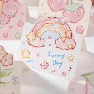 Détail macro d'une carte de vœux gribouillée avec arc-en-ciel et texte Sunny Day dessus