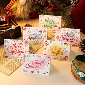 Detailed macro view showing six unique hand-drawn festive Christmas greeting card designs
