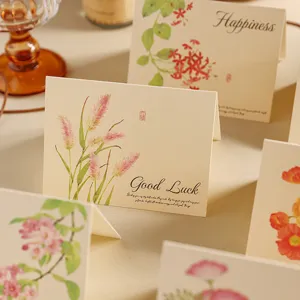Macro view of vintage kraft greeting card with elegant floral art and Good Luck motif