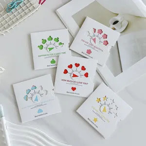 Detailed view of hollowed-out greeting cards with colorful rotating arrows