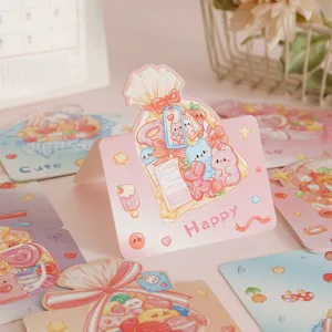 Close-up of pastel pink 3D greeting cards featuring cute cartoon candy bag illustrations