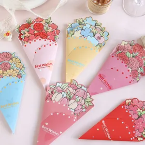Close-up of colorful floral bouquet greeting cards with Best Wishes text on pink background