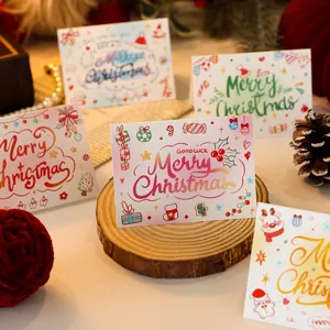 Detailed view of hand-drawn Christmas greeting cards with festive doodles