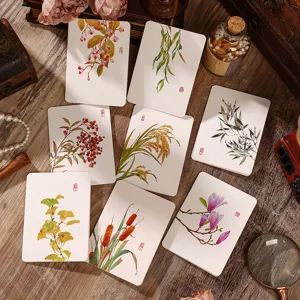 Vista detallata de tarjetas botánicas vintage con elegantes diseños de flores en acuarela.