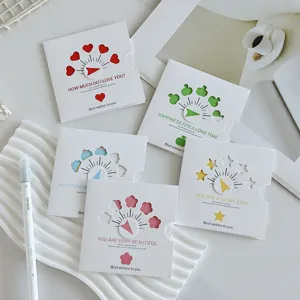 Close-up of creative minimalist rotating greeting cards with hollow heart designs