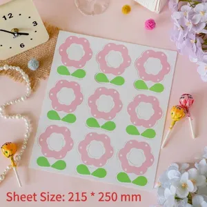 Detail view of a full sheet of nine pink flower lollipop cards, sized 215x250 mm