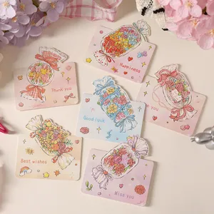 Detailed view of creative candy-shaped greeting cards with floral bouquet designs