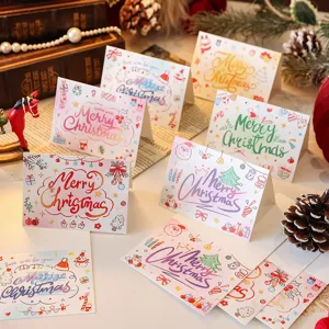 Close-up detail of festive Christmas greeting cards with colorful cartoon illustrations