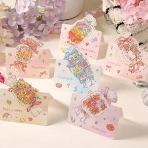 Detailed view of assorted cartoon flower bouquet greeting cards with English wishes.